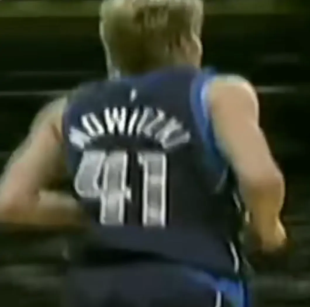 Dirk Nowitzki from behind, NOWITZKI 41 across his navy jersey